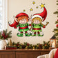 Christmas elf helpers sticker: two smiling cartoon elves, red hats, green coats, star accents