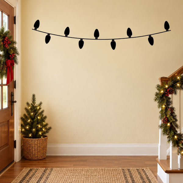 Wall decal string lights with black cord and small bulb silhouettes