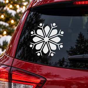 White snowflake decal on dark car window glass