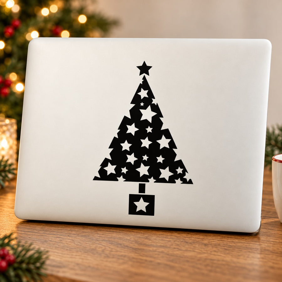 Black Christmas tree decal with star pattern on a white rectangular surface