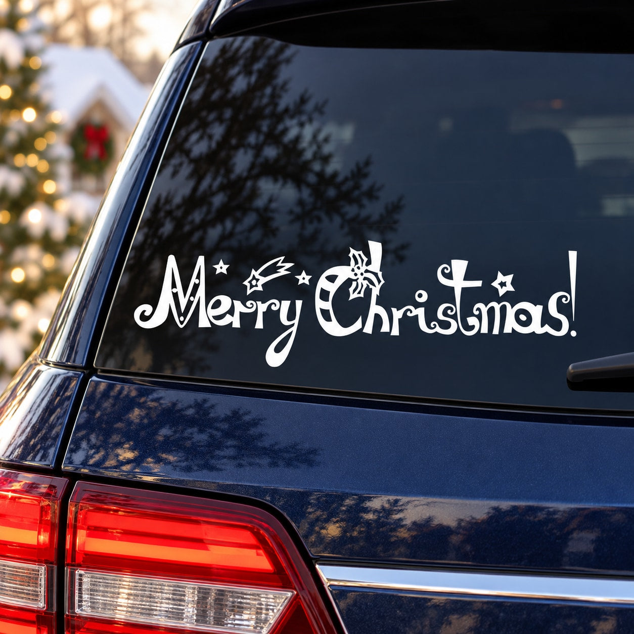 Jolly Merry Christmas decal with white cursive text and reindeer on car rear window