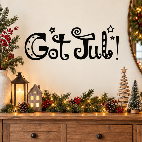 Black holiday wall decal with 'Got Jul!' lettering, stars and swirl accents