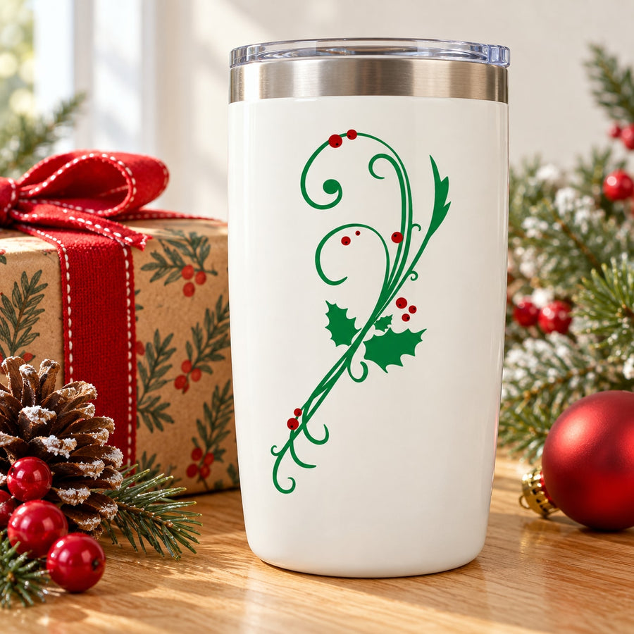 White tumbler with green holly and mistletoe branch die-cut decal with red berries