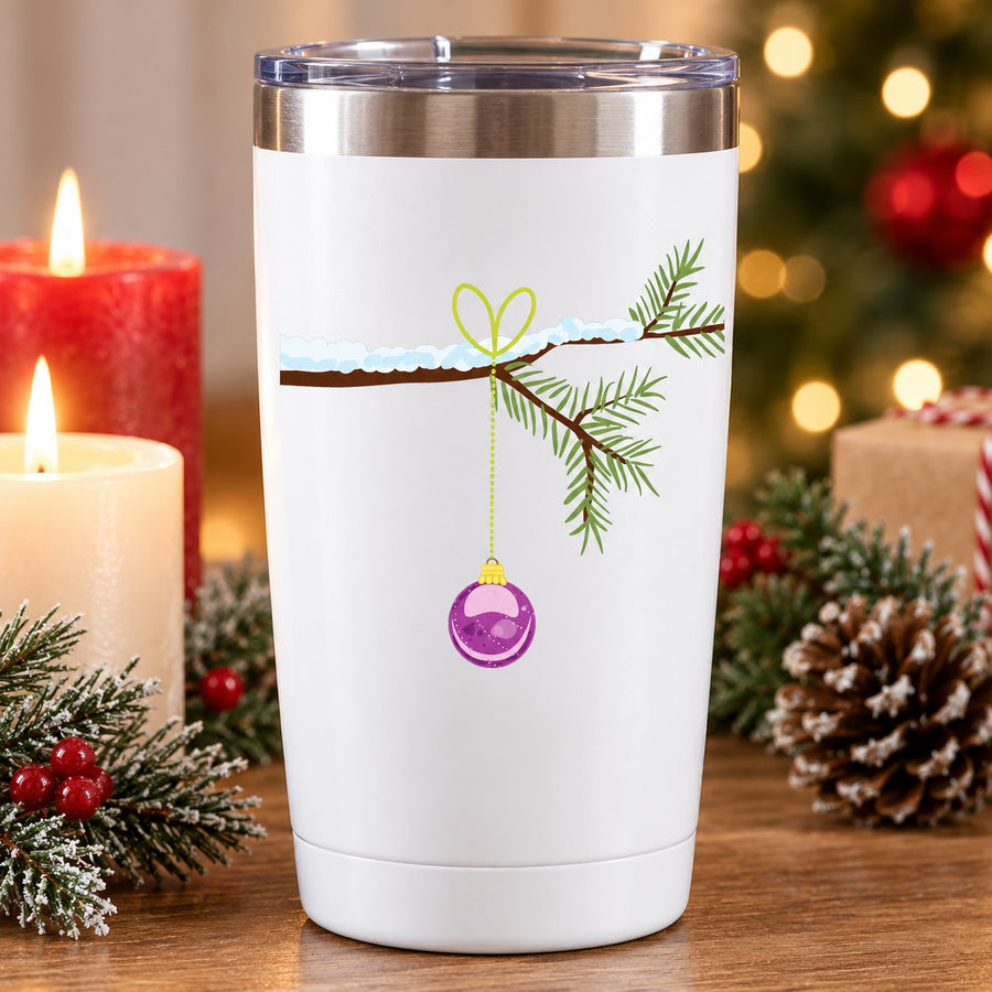 White tumbler with green pine branch and purple hanging ornament decal