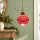 Red hanging Christmas ornament decal with white stripes and gold star, brown cap