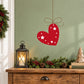 Red hanging heart ornament decal with white star print and thin loop for hanging