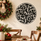 Round vine ornament decal with black filigree center and white background