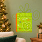 Green present-shaped die-cut decal with heart, star, and swirl pattern