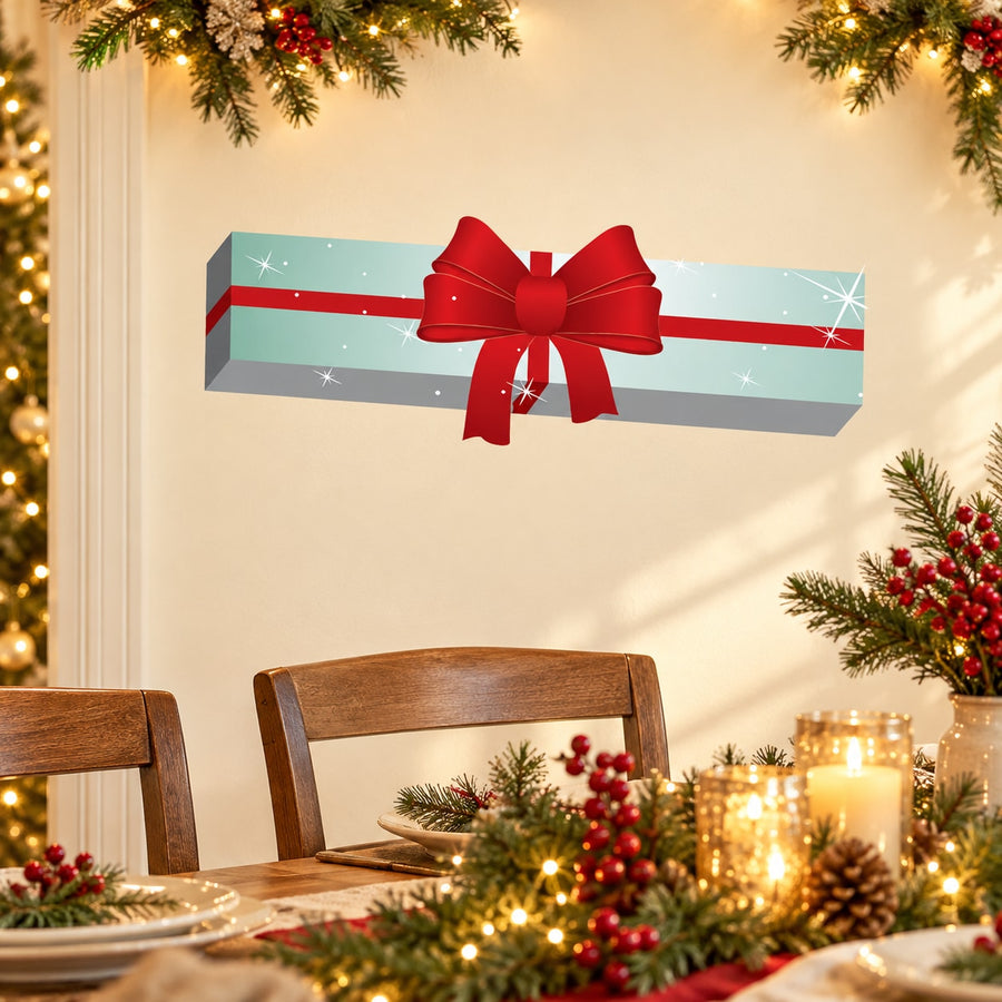 Long Christmas present sticker with red bow and sparkly gift on light blue strip