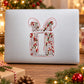 Holiday sticker with red and green candy-cane design on white rectangle