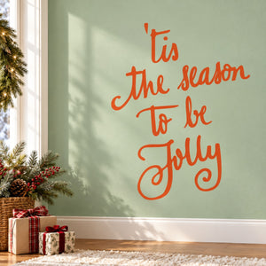 Orange cursive holiday quote wall decal: 'Tis the season to be jolly'