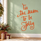 Orange cursive holiday quote wall decal: 'Tis the season to be jolly'