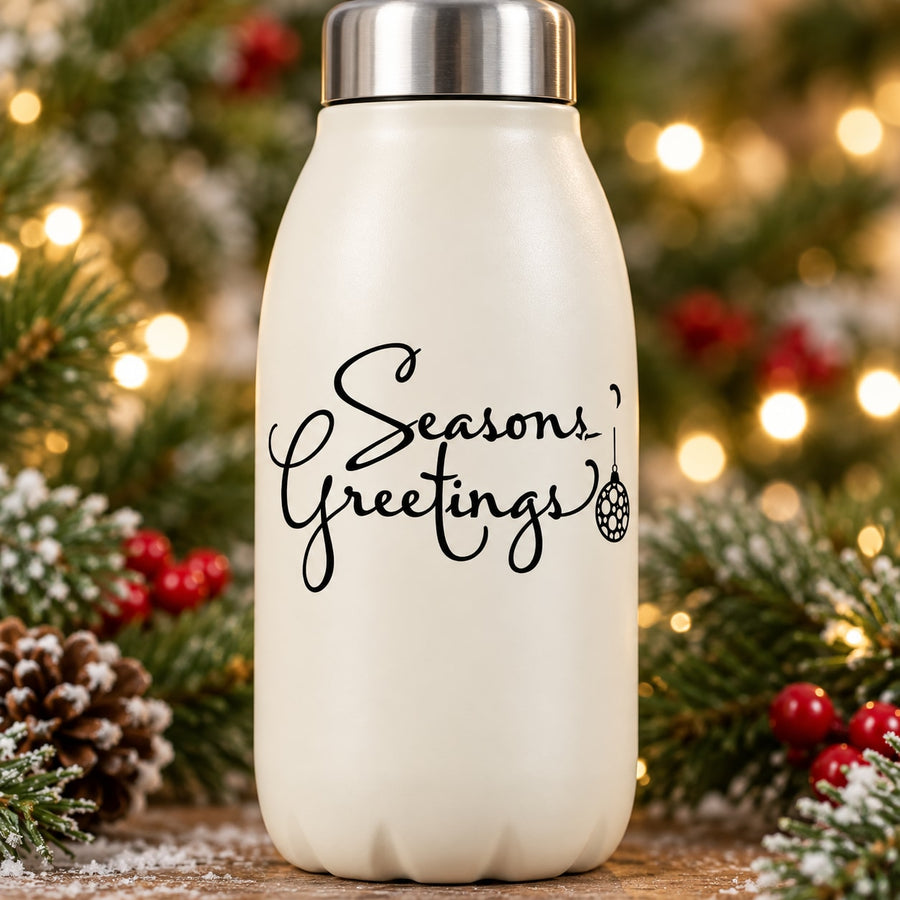 “Seasons Greetings” decorative decal with ornament icon on a light surface