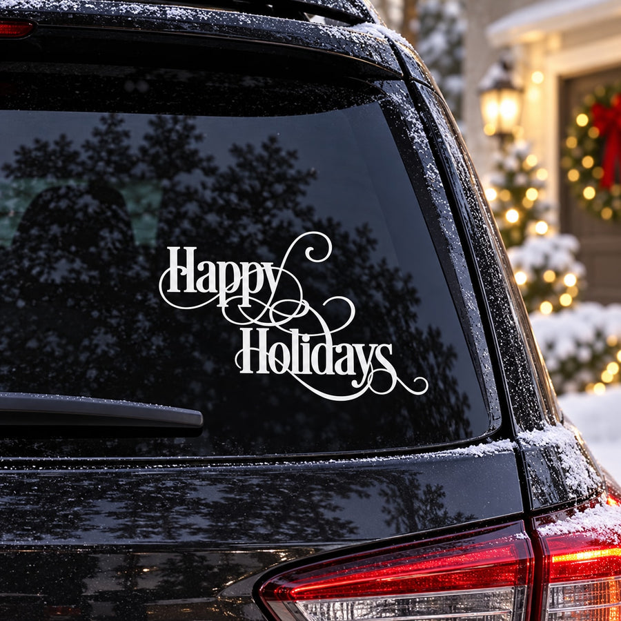 White swirl quote decal reading “Happy Holidays” on dark car window glass