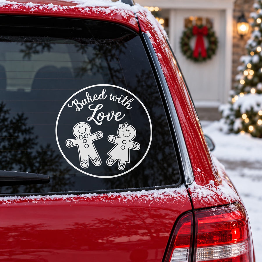 Round white car window decal with 'Baked with Love' text and gingerbread cookie icons