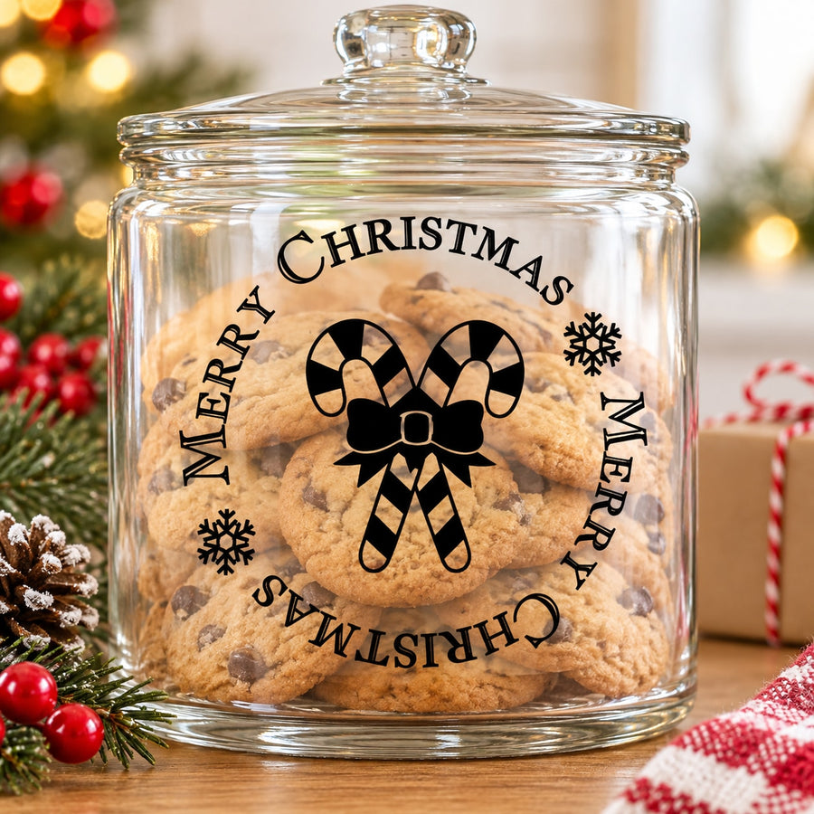 Clear glass cookie jar with lid, Merry Christmas decal and candy-cane design