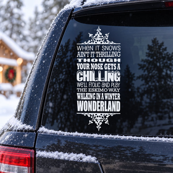 White winter typography decal with snowflake border on dark car window