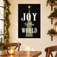 Christmas wall sticker with black background, yellow star, and white “Joy to the World” text