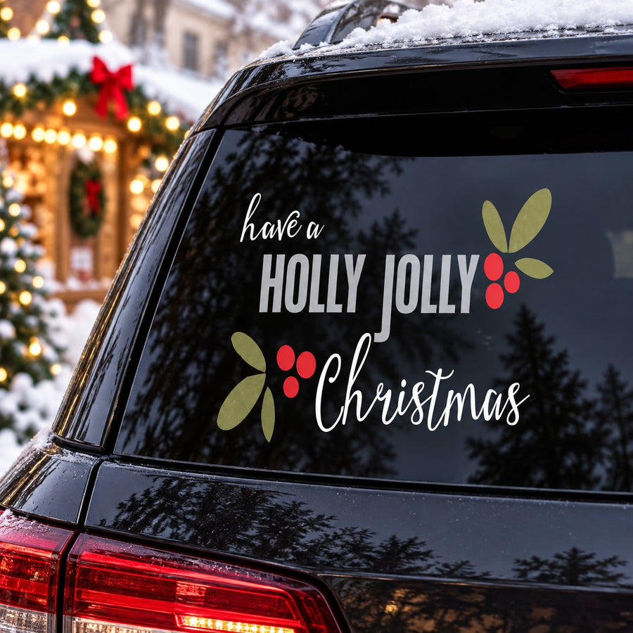 Christmas car window sticker reading “Have a HOLLY JOLLY Christmas” with holly icons