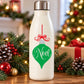 Noel ornament printed decal on white bottle, red ribbon and green ornament icon