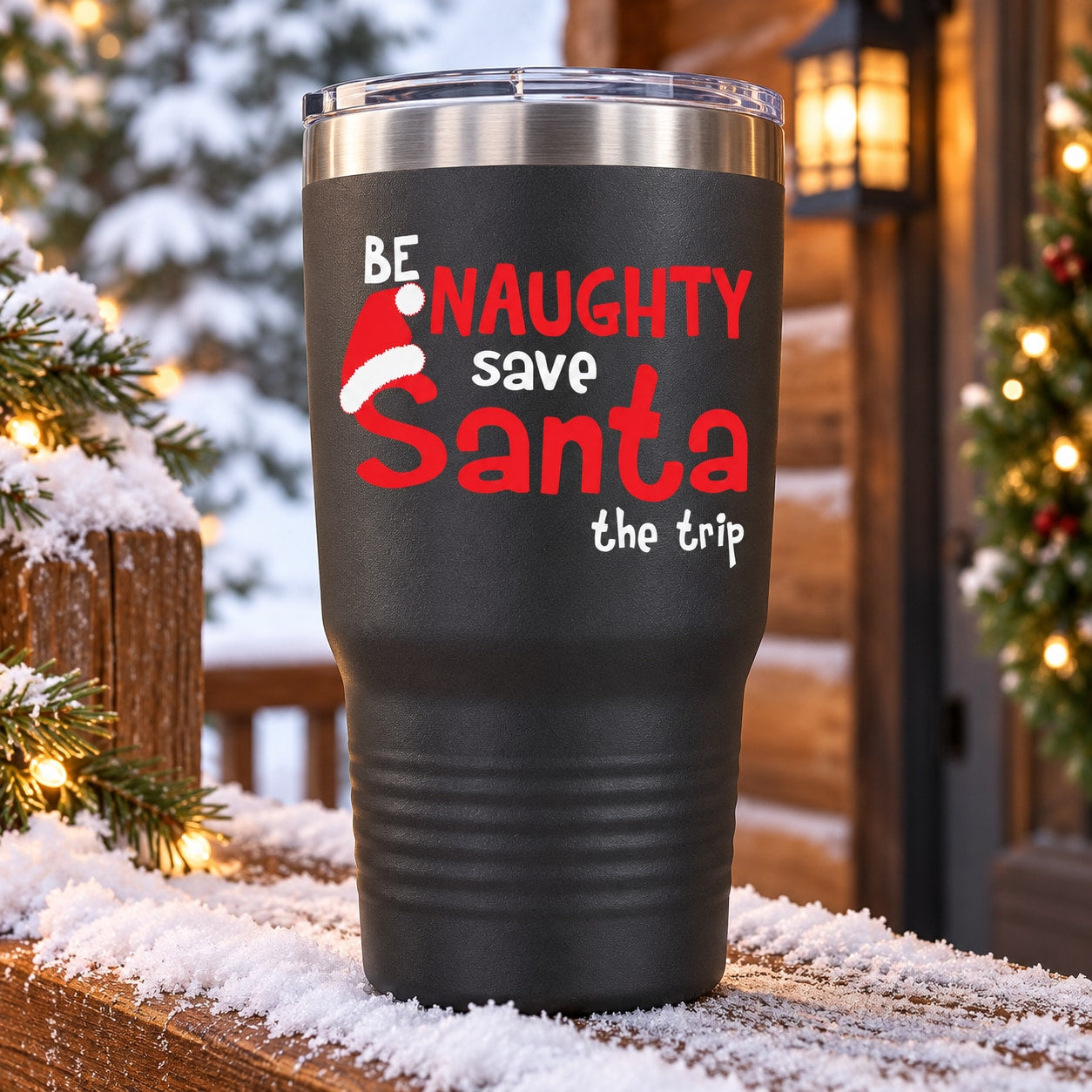 Black travel tumbler with red/white “Be Naughty Santa” message on front