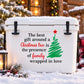 Christmas tree quote decal on white panel, green tree with red star and black lettering