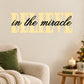 Script-printed wall decal reading "in the miracle"