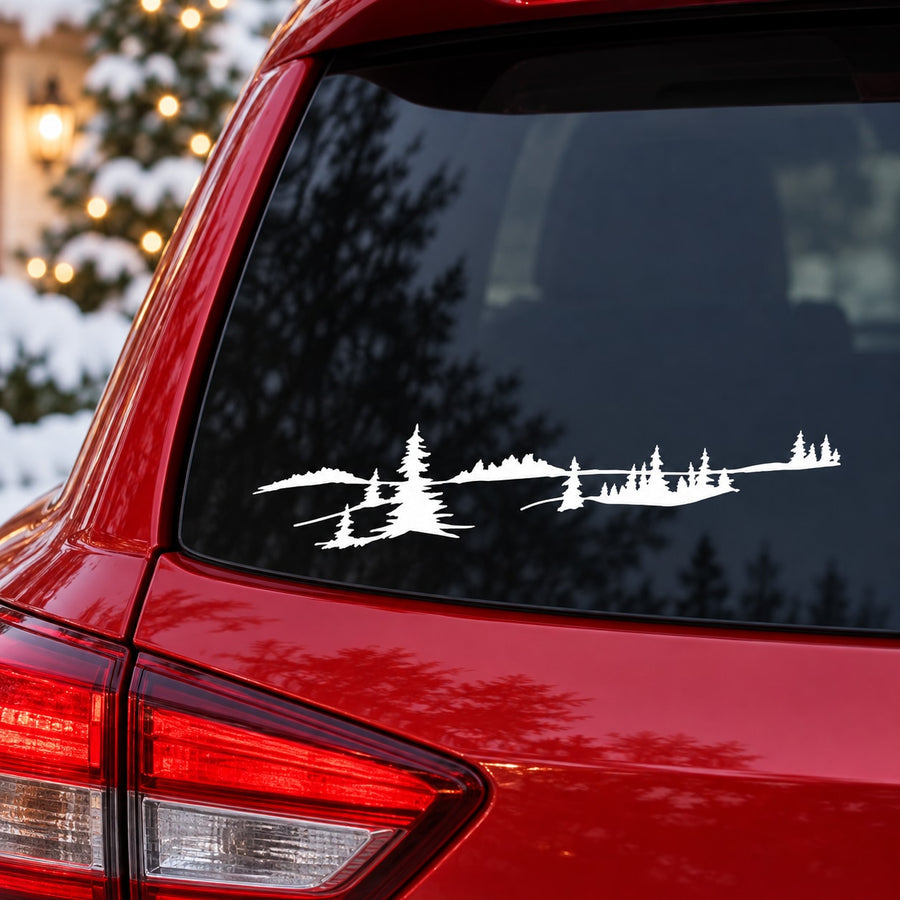 White snowy pine tree silhouette decal on car rear window