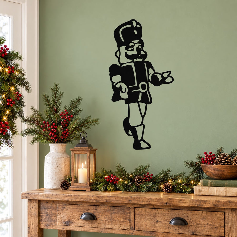 Black nutcracker character vinyl decal with festive hat and drum