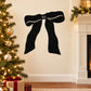 Black wavy tied ribbon wall decal with bow loops and trailing ends