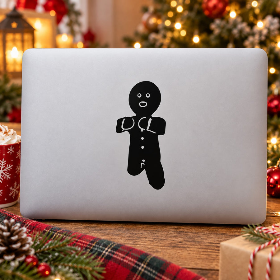 Black gingerbread man silhouette decal with face, buttons, and icing details