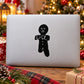 Black gingerbread man silhouette decal with face, buttons, and icing details