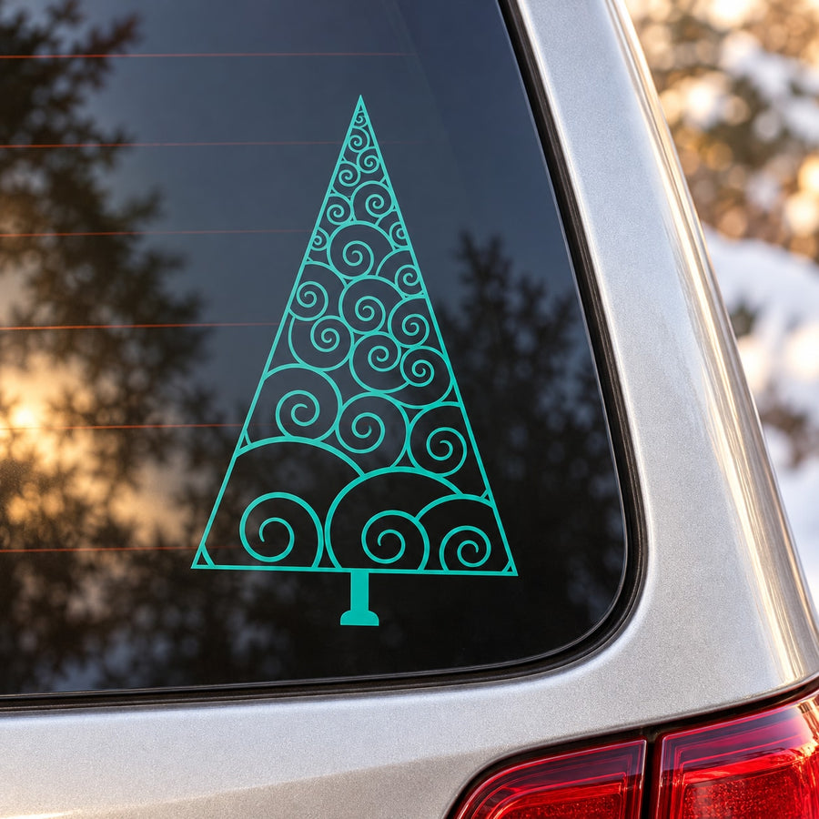 Teal swirled Christmas pine tree decal with star and trunk on window glass