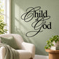 Child of God wall decal in black cursive script on a light wall