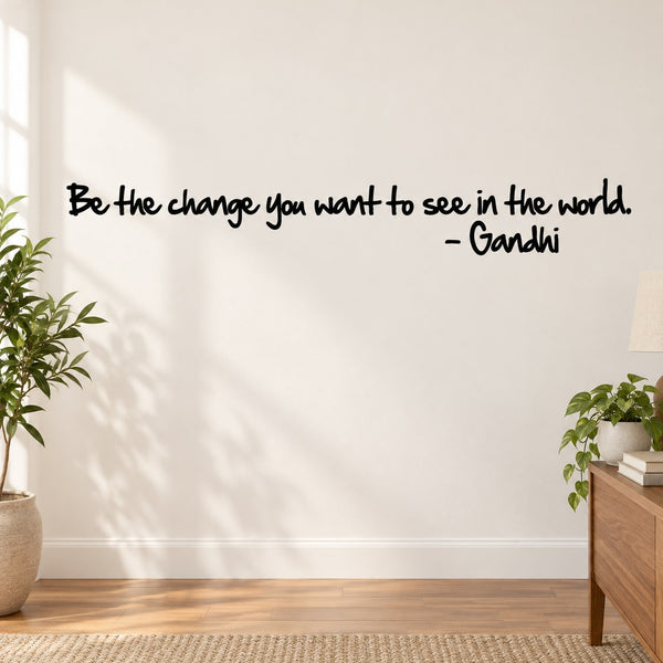Wall decal with text “Be the change you want to see in the world.” Gandhi