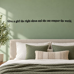 Wall quote decal with black quote text: “Give a girl the right shoes...conquer the world.”