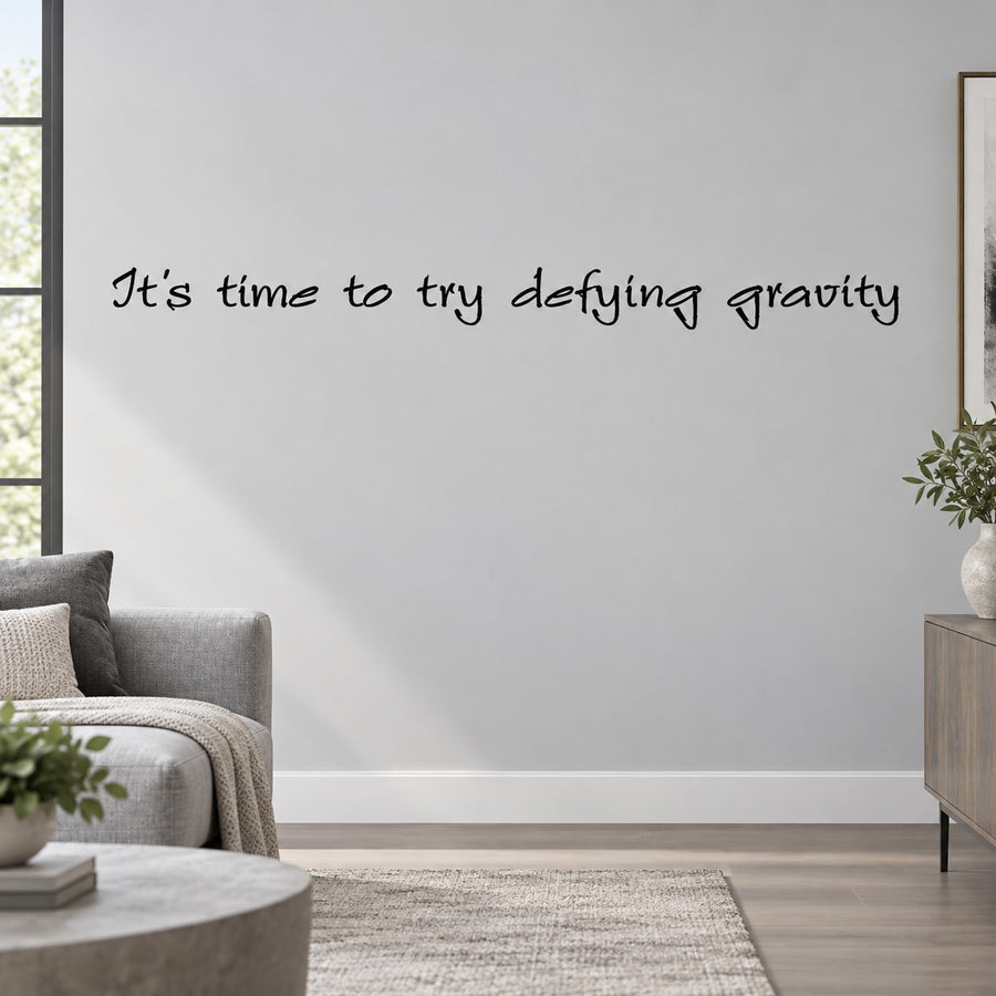 Wall decal with handwritten text: It’s time to try defying gravity