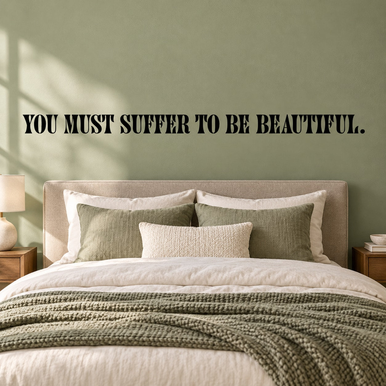 Wall decal with 'YOU MUST SUFFER TO BE BEAUTIFUL' lettering