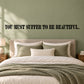 Wall decal with 'YOU MUST SUFFER TO BE BEAUTIFUL' lettering