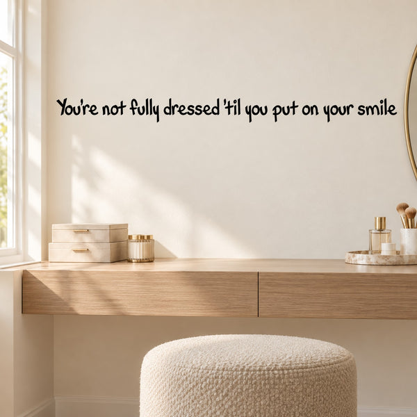 Wall quote decal with text: “You're not fully dressed til you put on your smile”