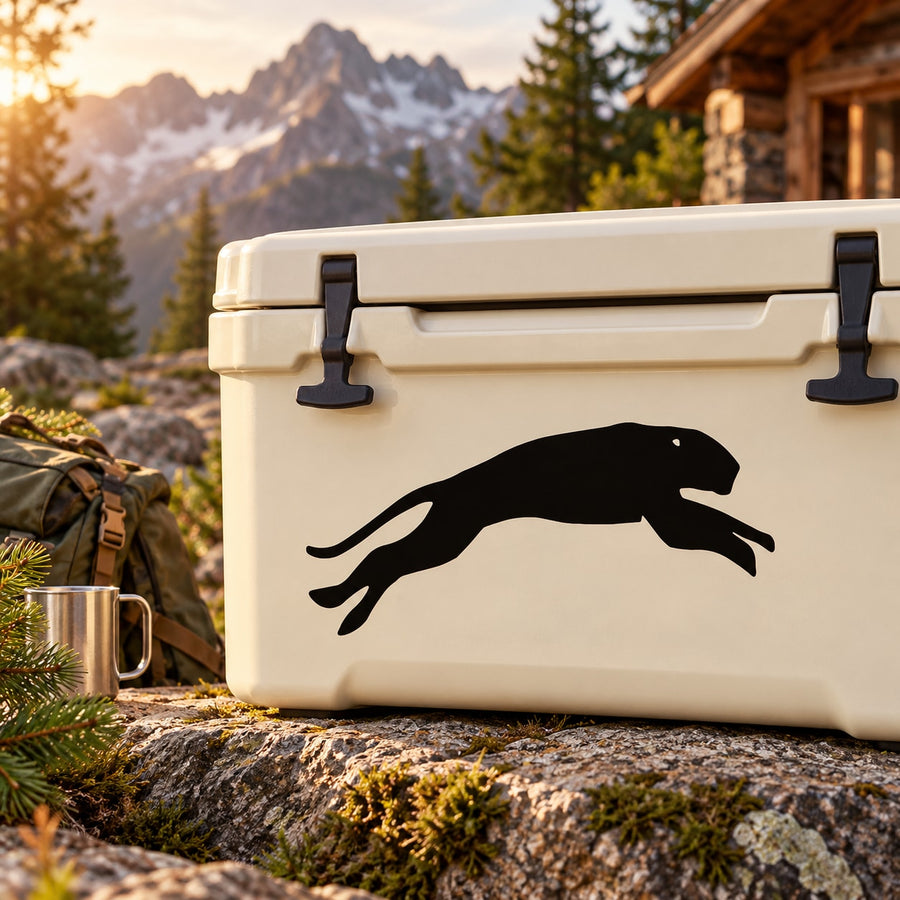 Cougar leaping decal with black silhouette on light surface
