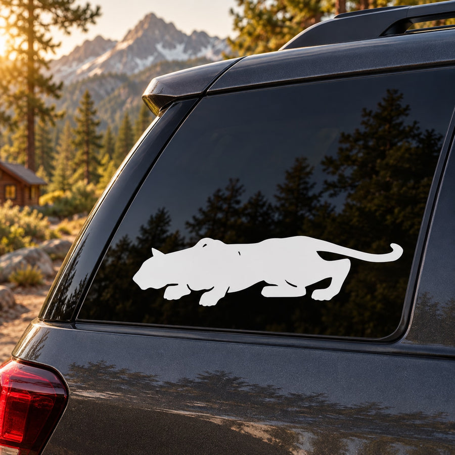 Crouching cougar decal, white silhouette on a car rear window