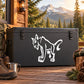 Smiling cougar decal with white illustrated cat on dark background.