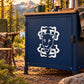 Tribal cougar head decal in white on dark blue cabinet door