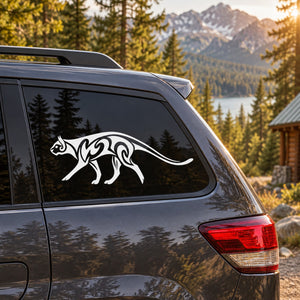 Tribal cougar decal, white walking cat graphic on dark car window