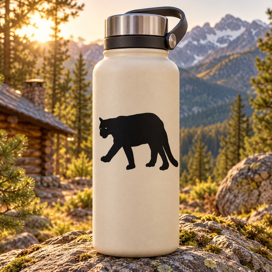 Cream water bottle with black cougar decal and handle lid