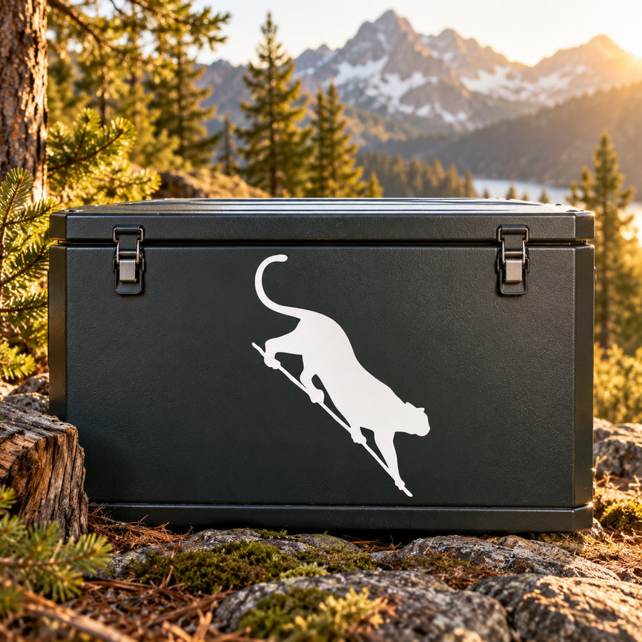 Cougar stepping down decal, white cougar silhouette on dark rectangular surface