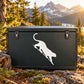 Cougar stepping down decal, white cougar silhouette on dark rectangular surface