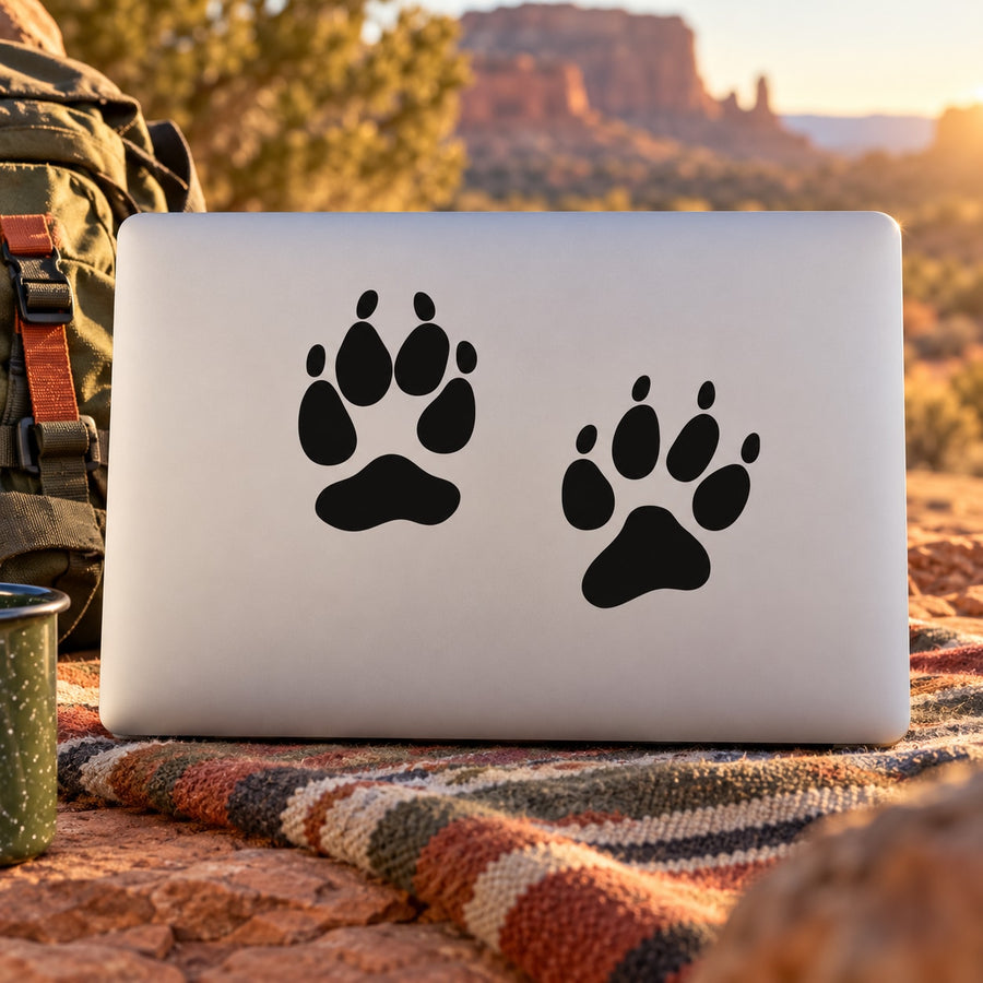 Paw track decal with two black paw prints on white rectangular backing