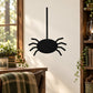 Black spider wall decal with dangling body and eight legs